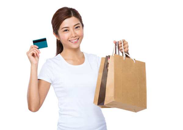 Woman with shopping bag and credit card